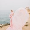 Light pink fancy maternity dresses by the seaside