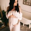 Light pink maternity photoshoot in the house